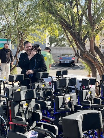 Allen Sarac with Sara the rescued capuchin at a community wheelchair donation drive